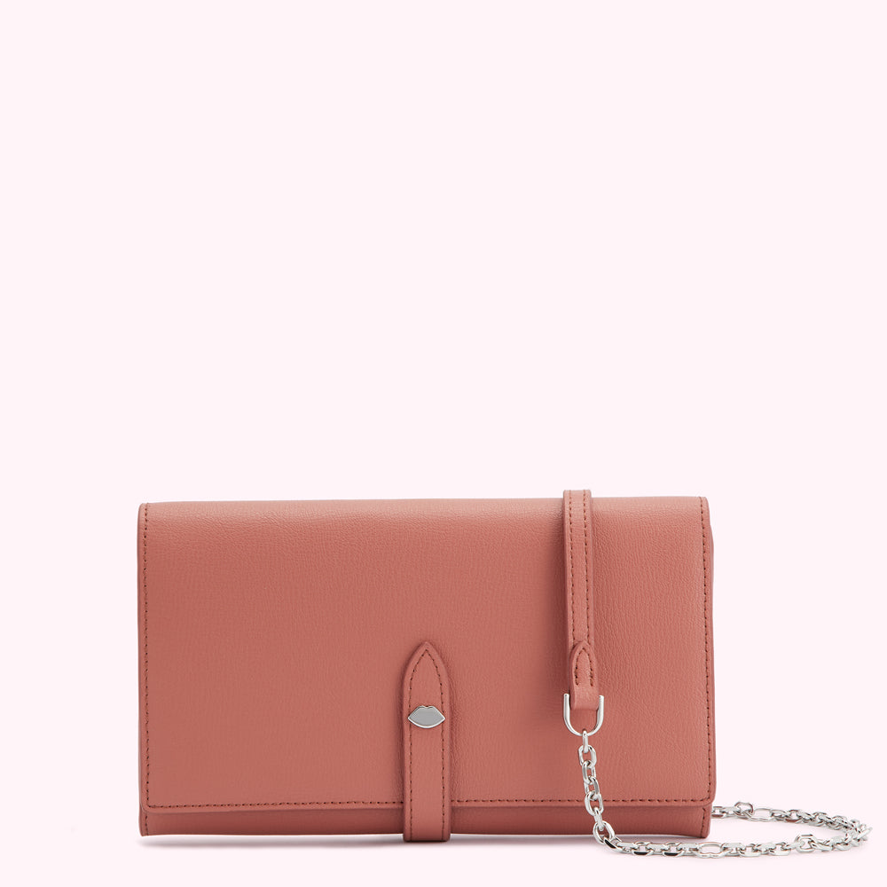 Dusty rose leather wallet with a detachable chain strap.