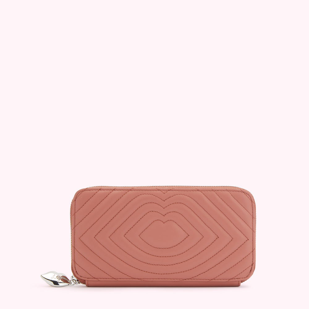 Dusty rose quilted leather zip-around wallet with a lip design.