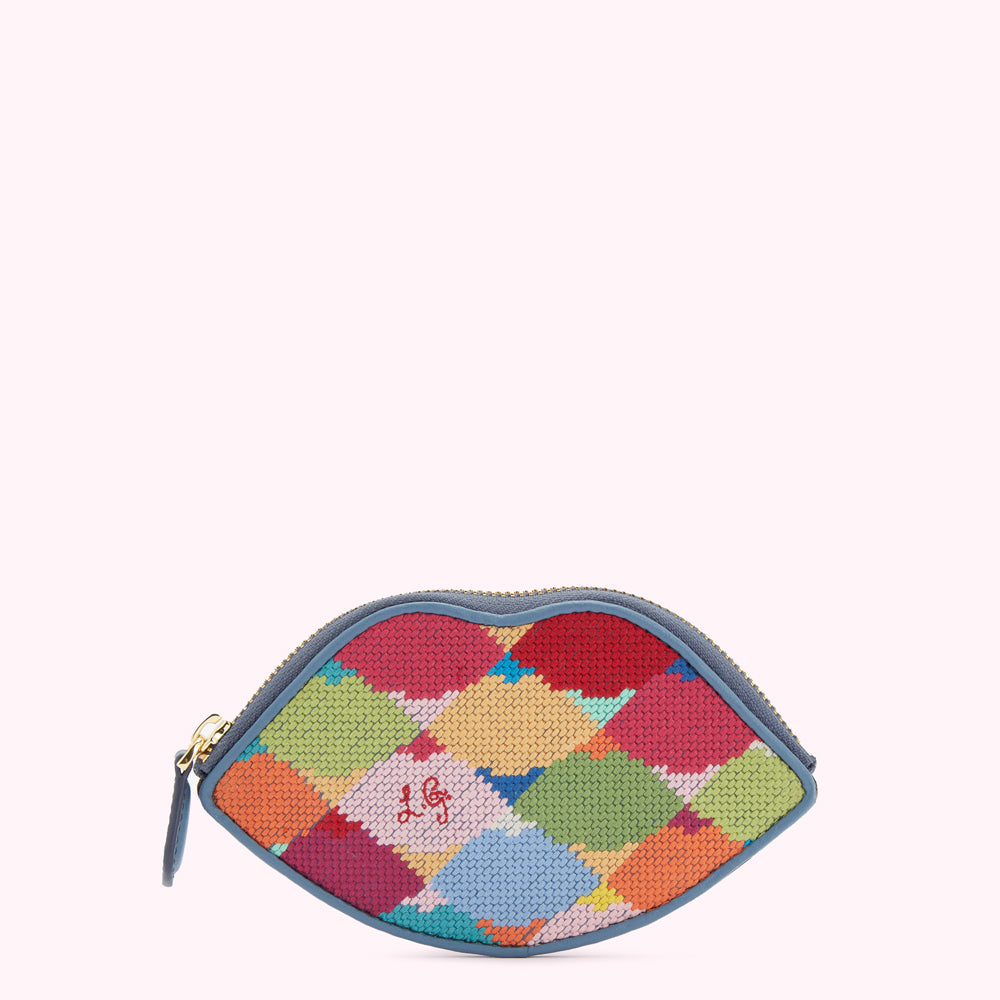 Multi-coloured needlepoint lip-shaped coin purse with a blue leather trim.