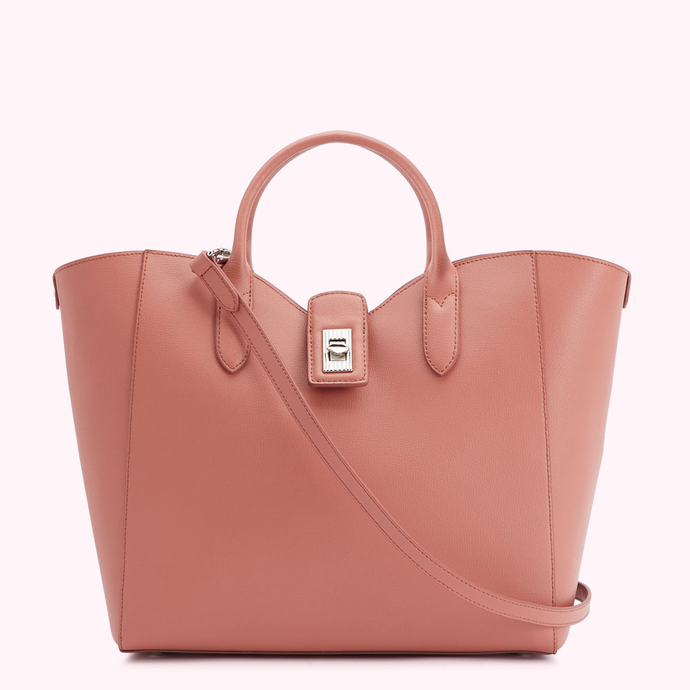 Dusty rose leather tote bag with a top handle and shoulder strap, and silver clasp.