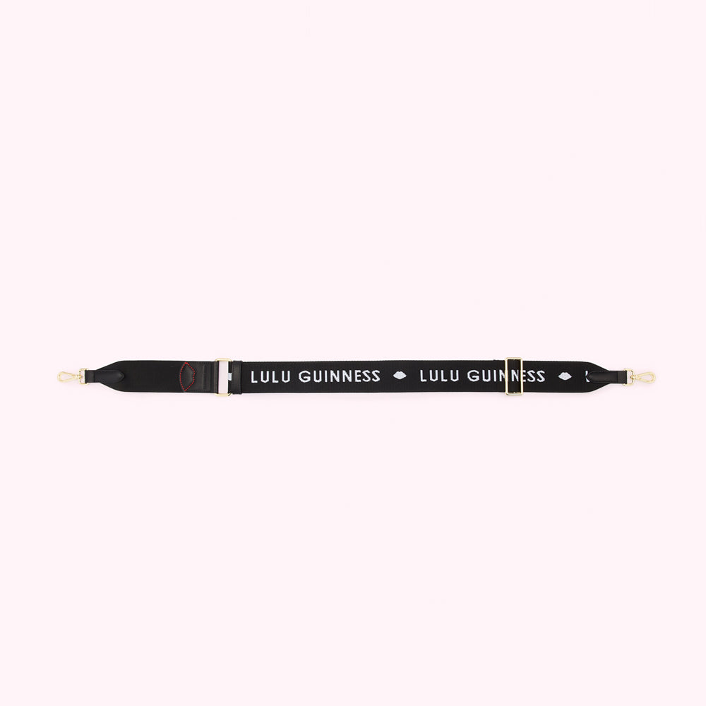 Black shoulder strap with gold clasps and the Lulu Guinness logo in white.