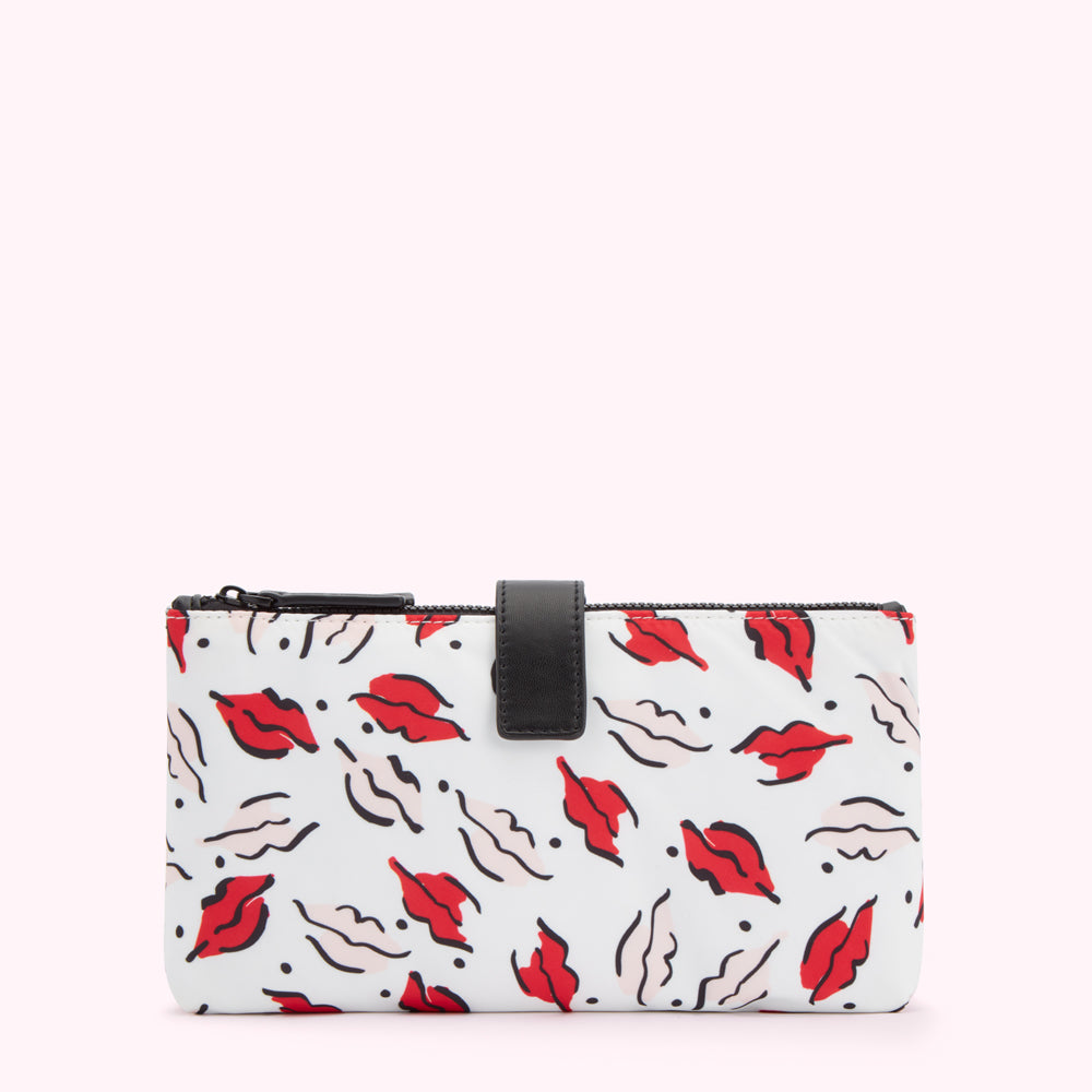 White makeup bag with red lips pattern.