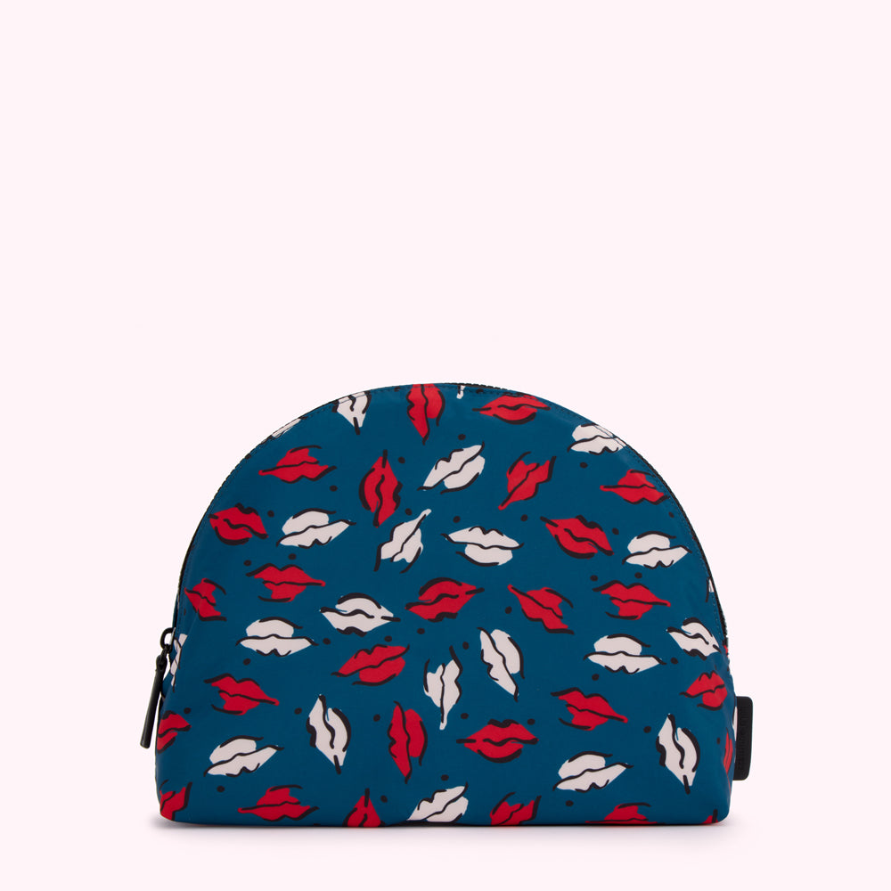 Teal half-moon shaped cosmetic bag with a red and white lips print.