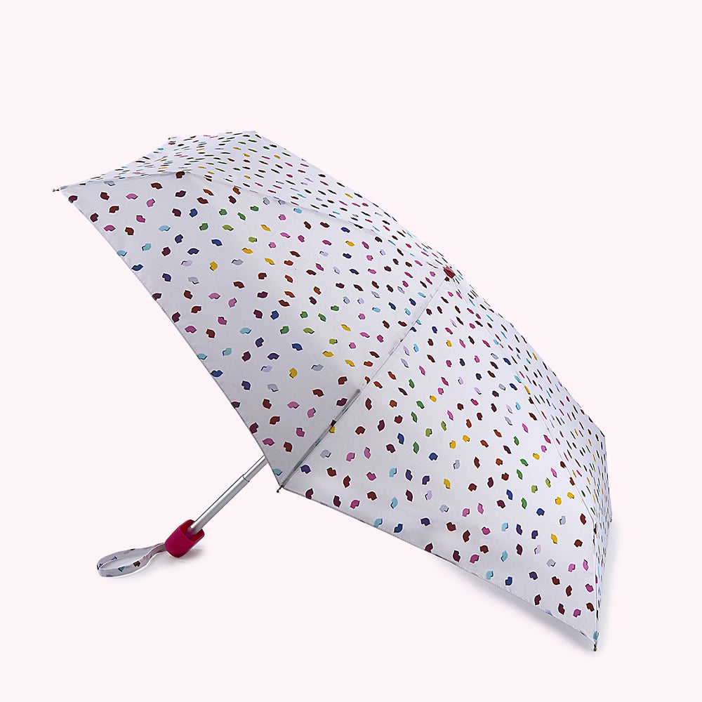 Compact umbrella with a white background and multicolored lip print.