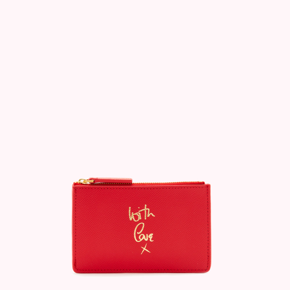 Red leather zip pouch with gold lettering that says "With Love X".