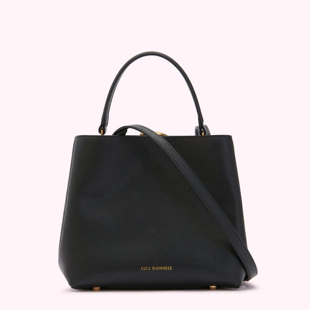 Black Lulu Guinness leather handbag with gold-tone hardware and detachable shoulder strap.