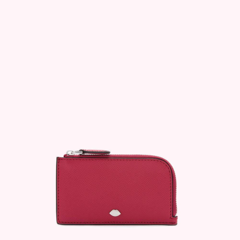 A crimson-colored leather zip-around cardholder against a white background.