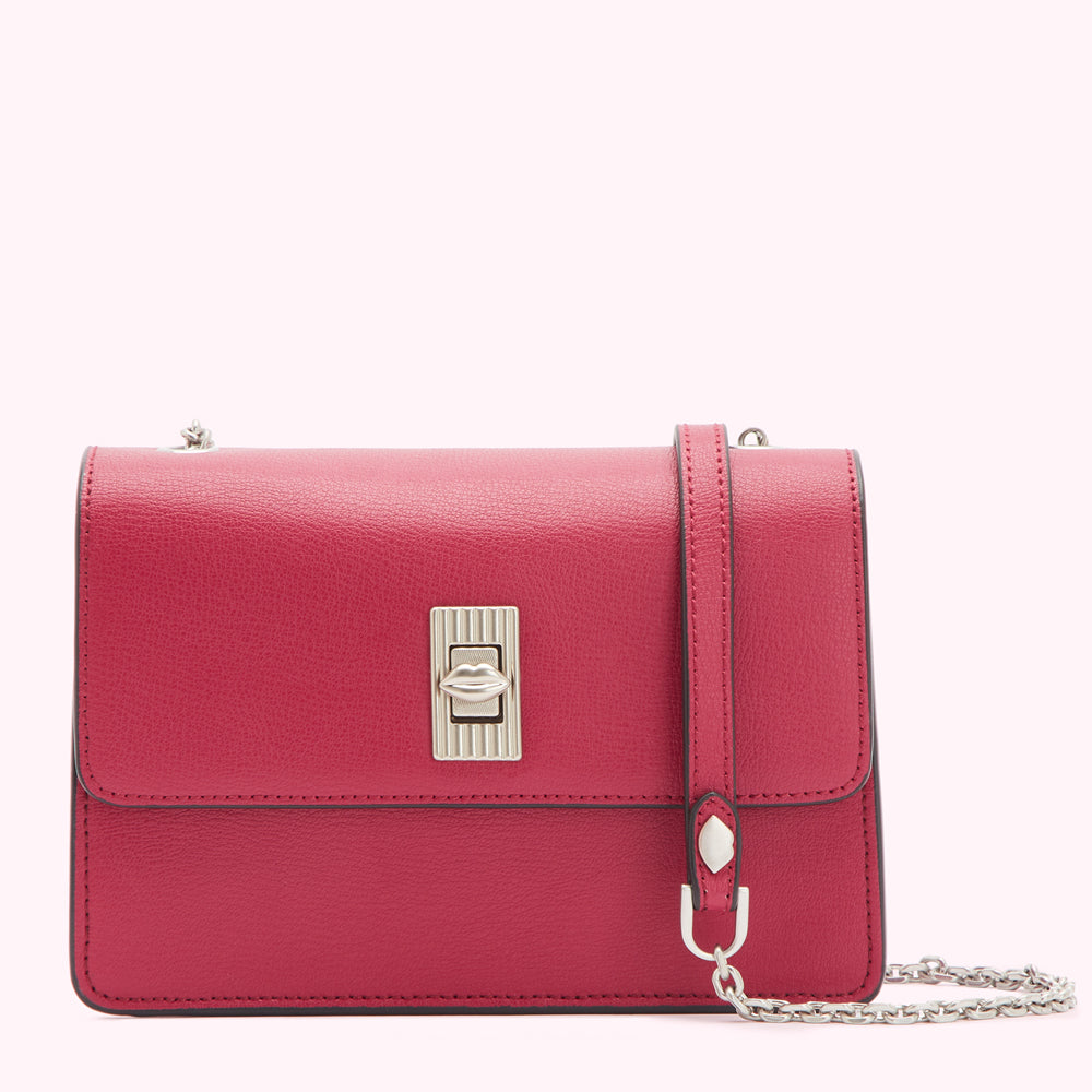 A crimson red leather crossbody bag with a silver lip-shaped clasp and chain strap.