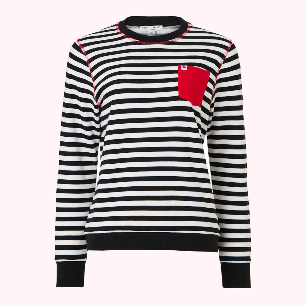 Black and white striped long-sleeved top with a red pocket.