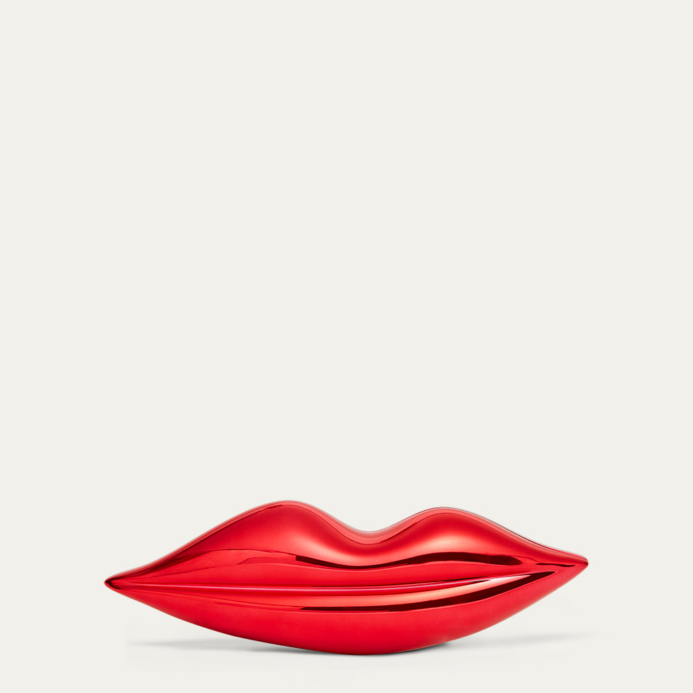 Red lip-shaped clutch bag on a light gray background