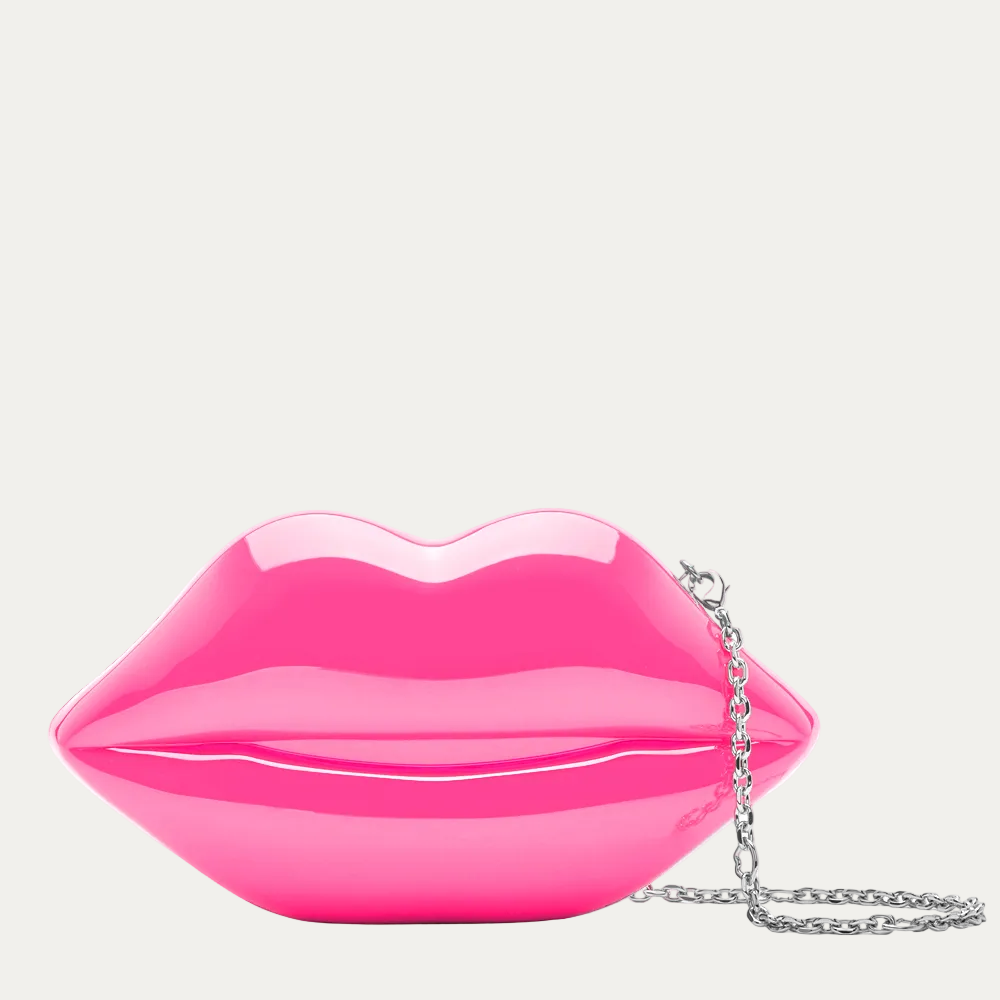 Pink lip-shaped handbag with a chain on a white background