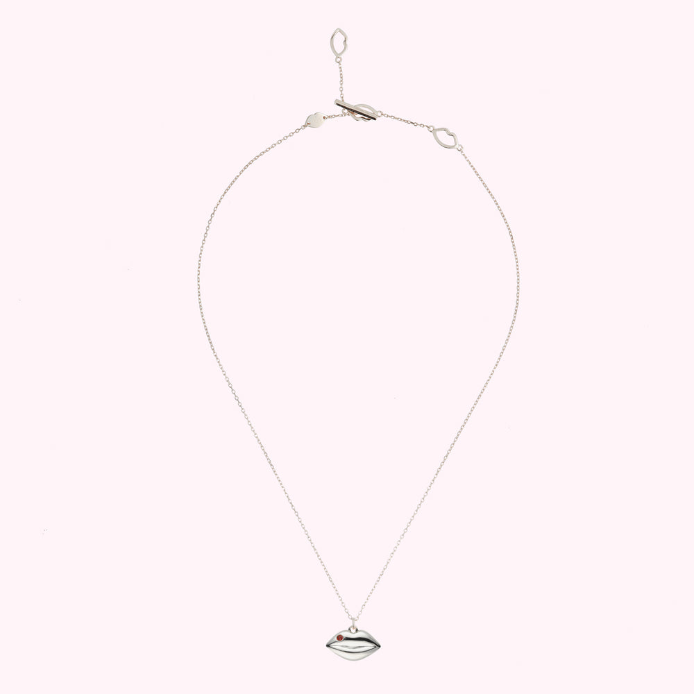 Sterling silver necklace with solid lip pendant charm featuring a inset Ruby precious stone.