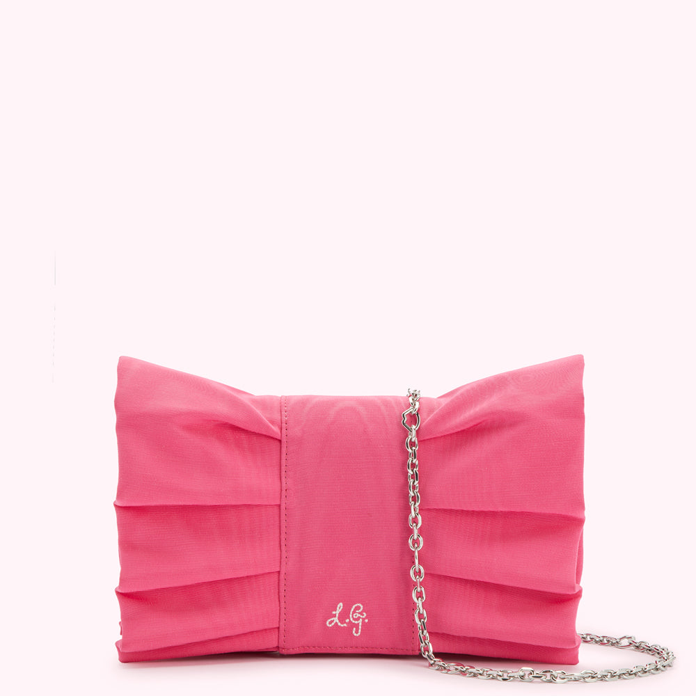 Pink pleated bow clutch with silver chain strap.