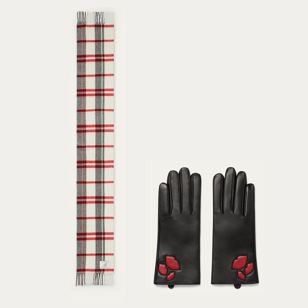 Black gloves with red lip details and a plaid scarf on a white background