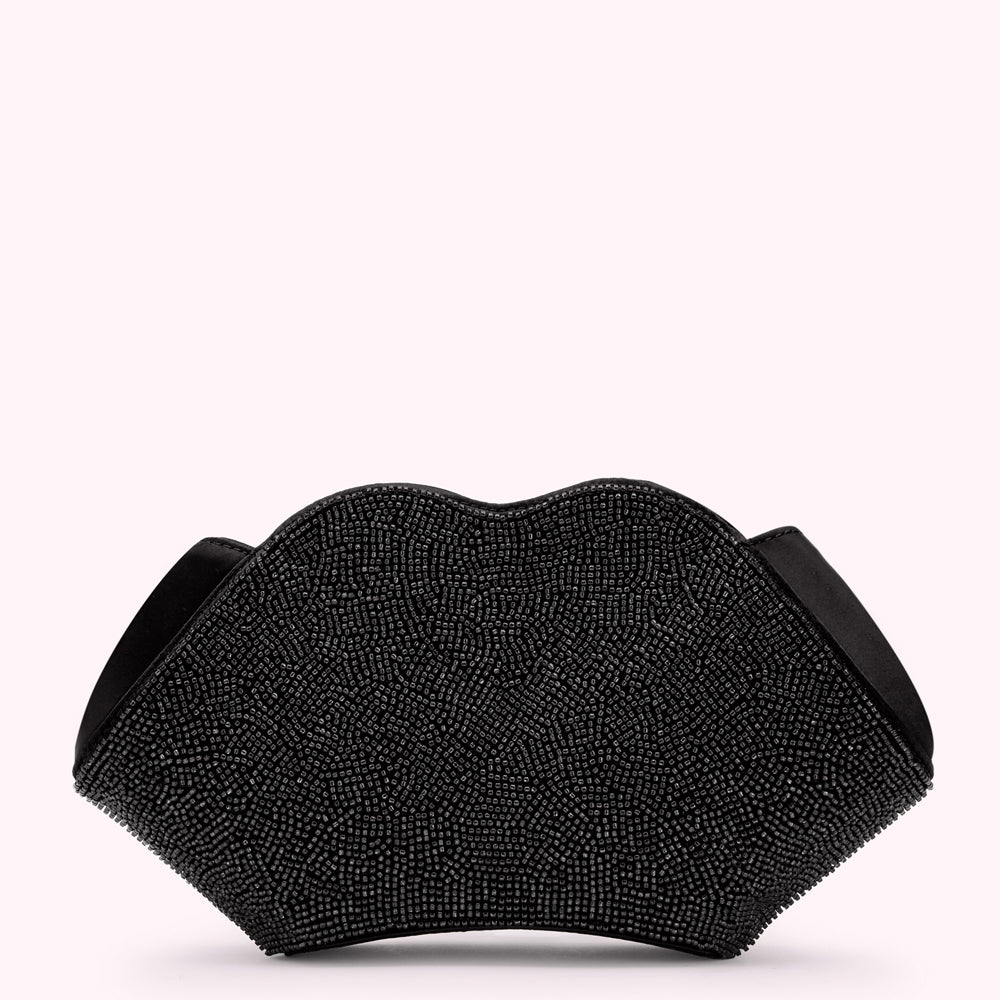 Black beaded lip-shaped clutch bag against a white background.
