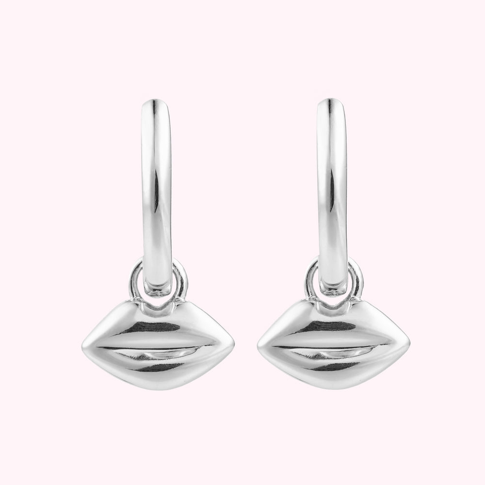 Front image of a pair or sterling silver hoop earrings with lip charms.