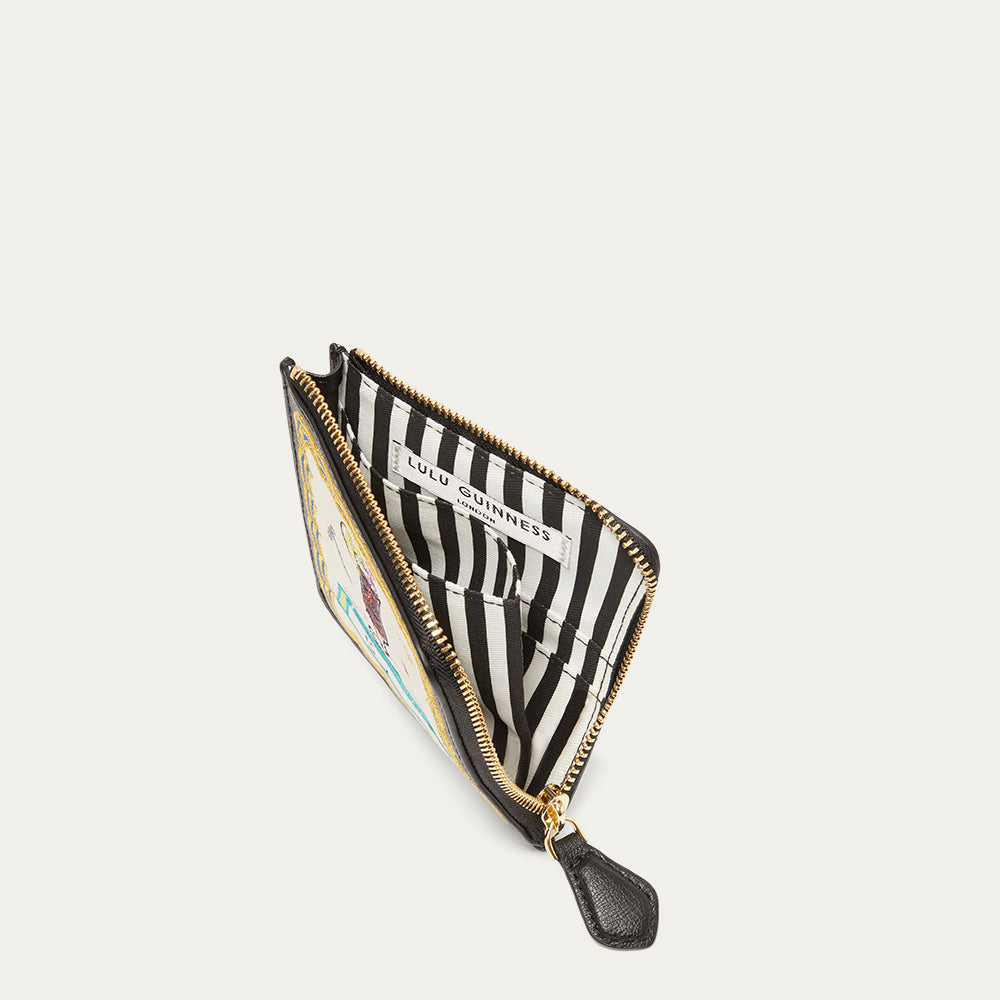 Inside image of a coin purse revealing a black and white striped lining with gold zipper on a light grey background