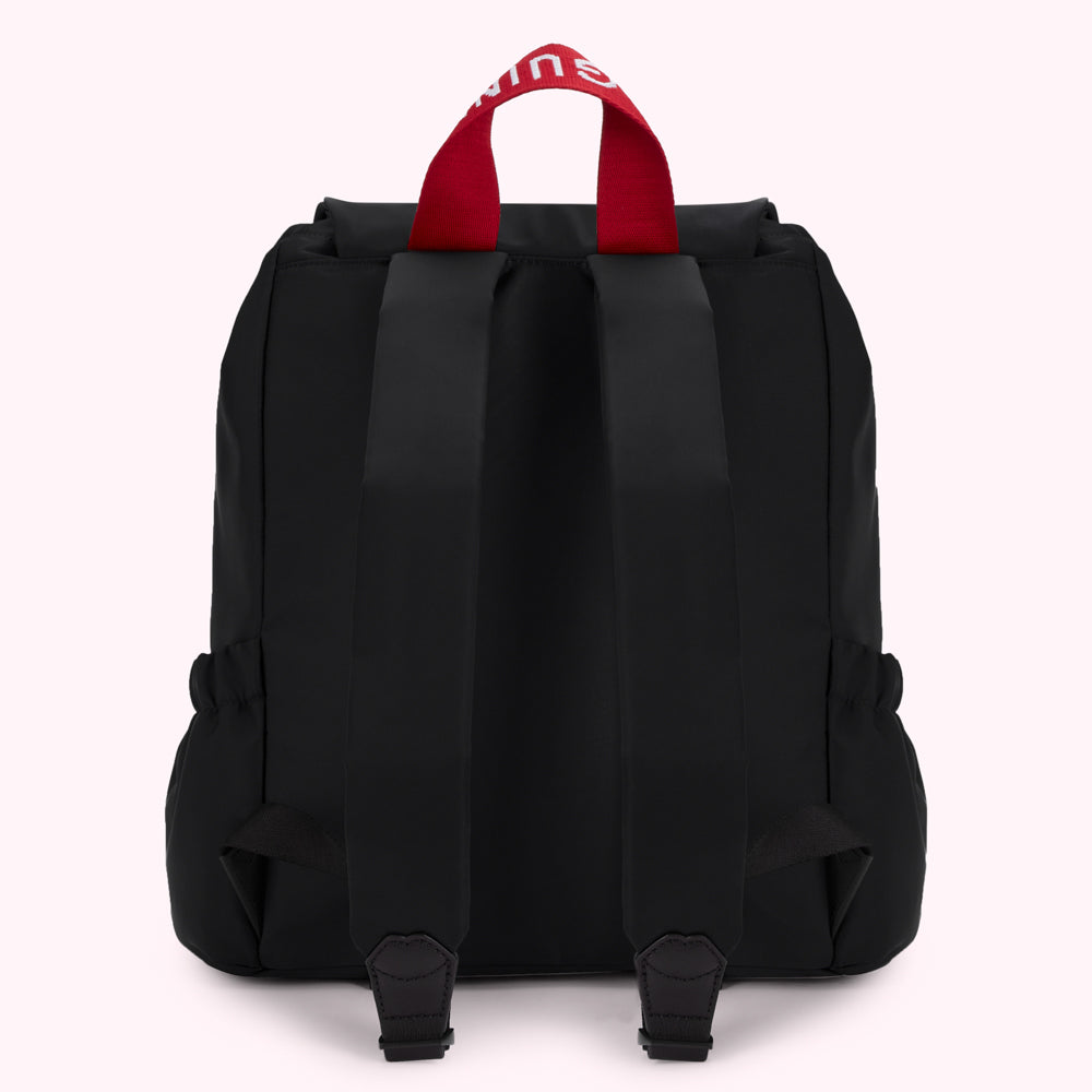Black backpack with red carrying handle and white logo.
