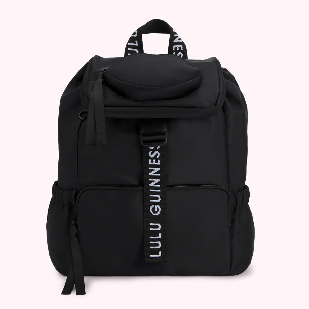Black Lulu Guinness backpack with a central white logo strap.