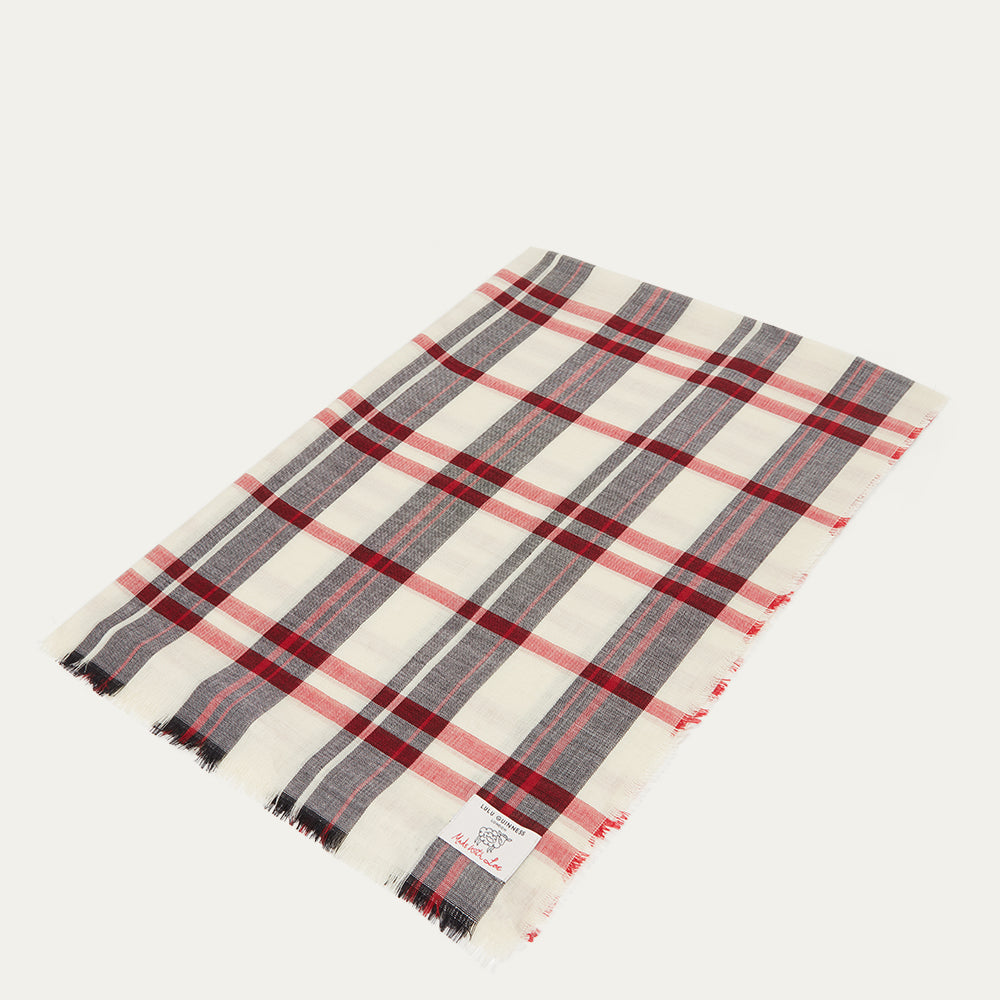 Plaid scarf with red, black and ivory patterns on a white background