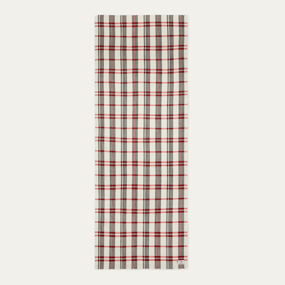 Plaid scarf with red, black and ivory tartan on a white background