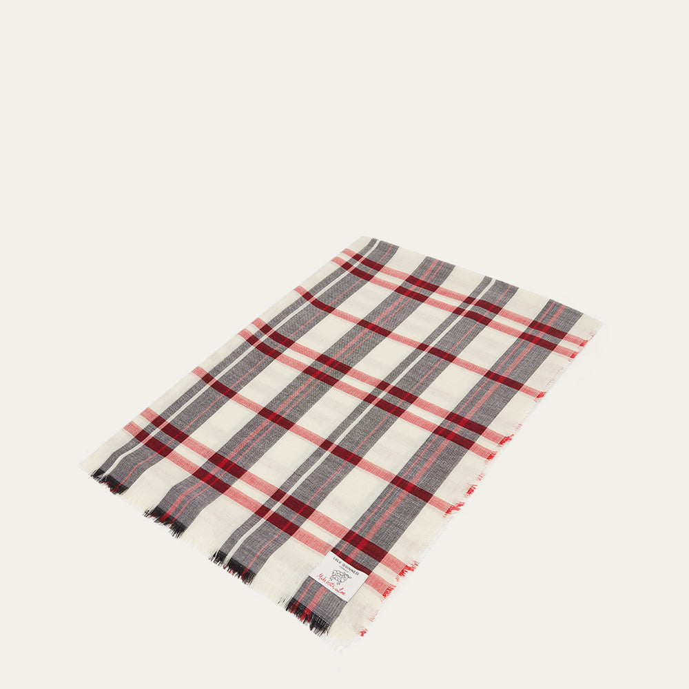 Plaid scarf with red, black and ivory patterns on a white background
