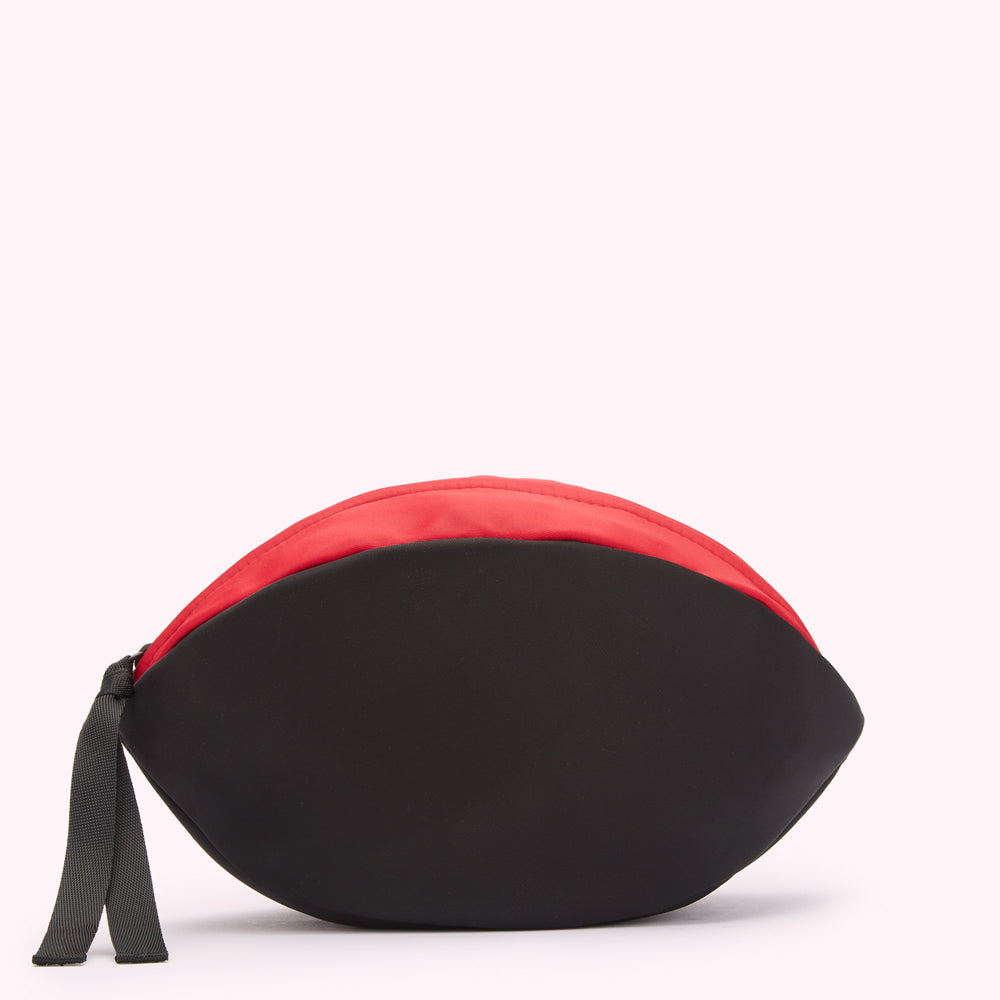 Black and red half-moon shaped pouch on white background.
