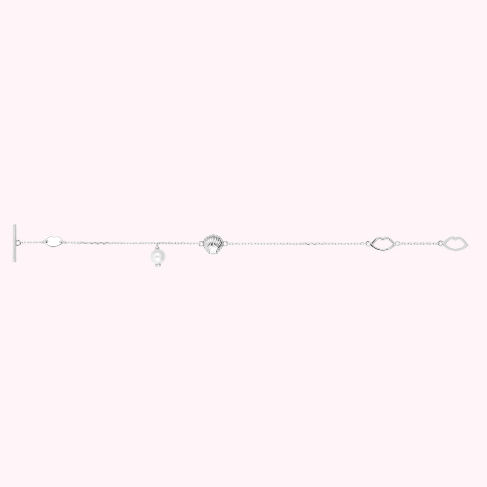 Flat image of a sterling silver bracelet with shell and freshwater pearl charms and lip shaped links.