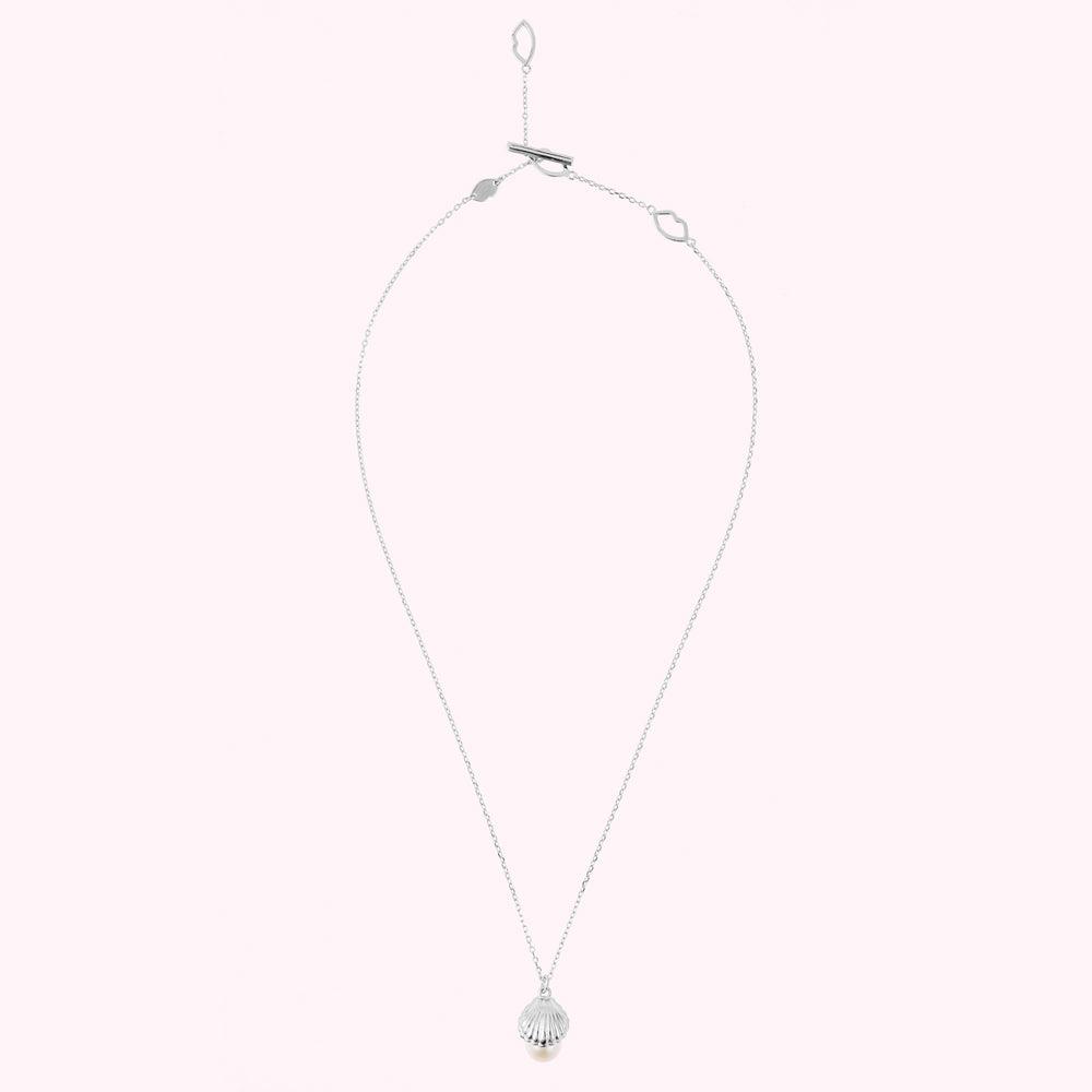 Sterling silver shell pendant with a freshwater pearl, lip chain links and engraved L.G monogram.