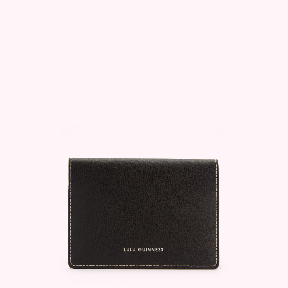 Black Lulu Guinness cardholder with off-white stitching.
