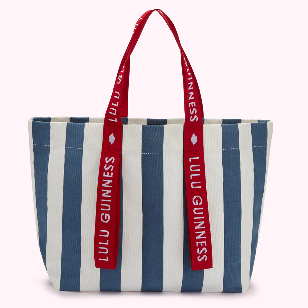 Blue and white striped tote bag with red Lulu Guinness branded straps.
