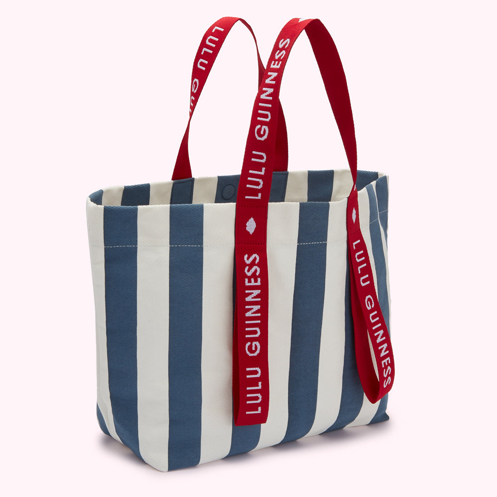 Blue and white striped tote bag with red Lulu Guinness logo straps.