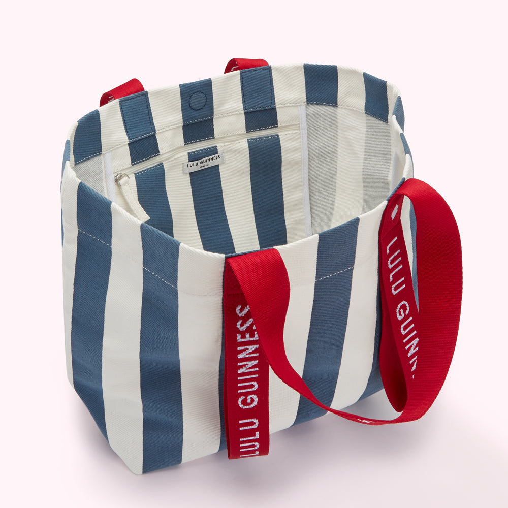 Blue and white striped tote bag with red Lulu Guinness branded handles.
