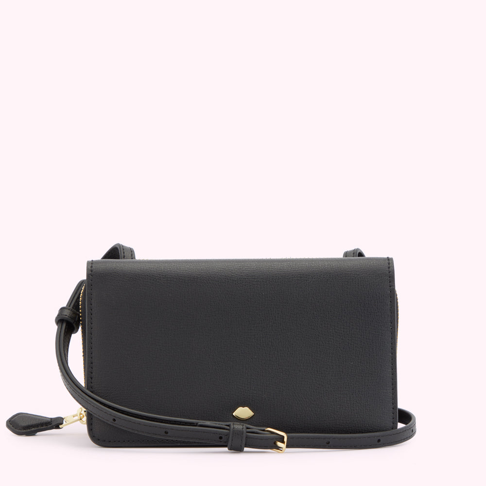 Front image of a black leather crossbody bag with a gold metal zip, buckle and lip shaped detail.