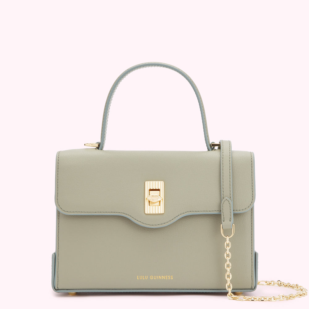 Sage green Lulu Guinness handbag with gold clasp and chain strap.