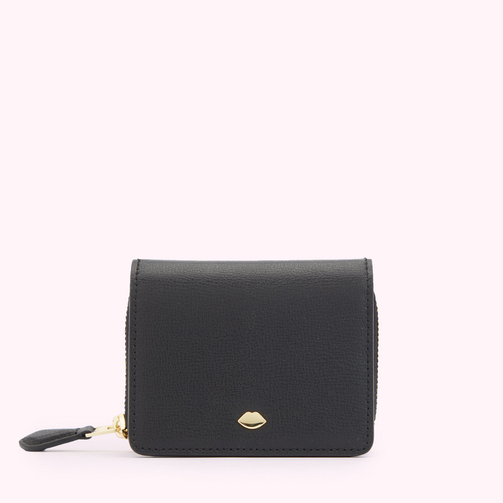 Front image of a black leather pure with gold zipper and gold metal lip pin detail.