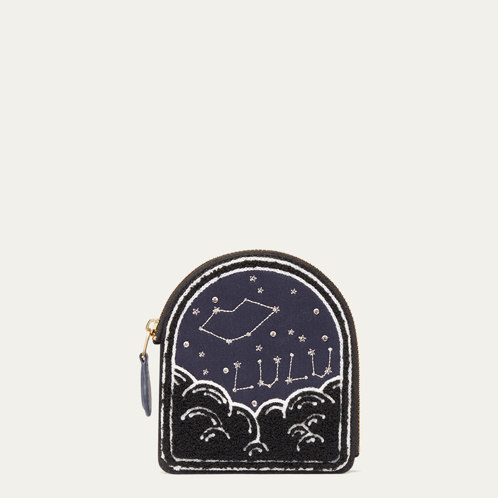 Small coin purse with star design and 'Lulu' text on a white background