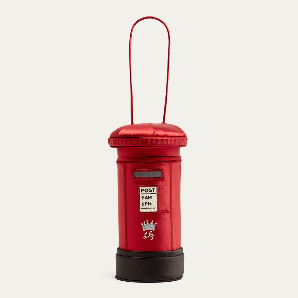 Red post box-shaped handbag with a black base on a white background