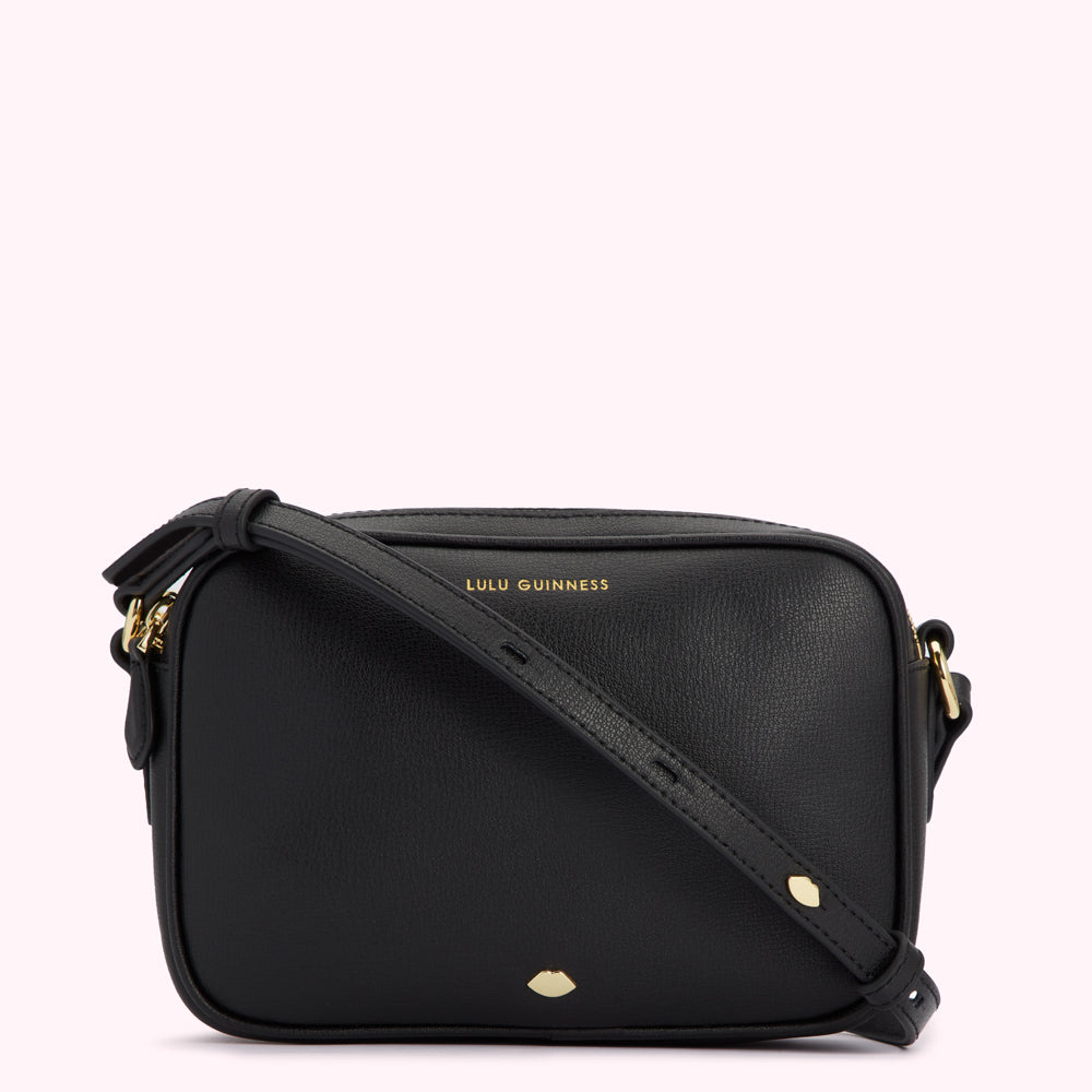 Black Lulu Guinness crossbody bag with gold hardware.
