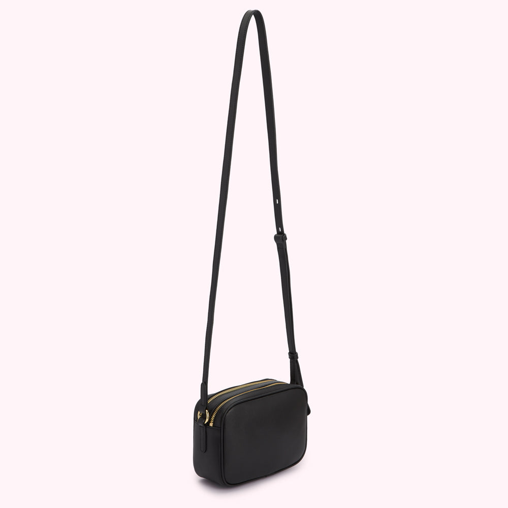 Black leather crossbody bag with gold zippers.
