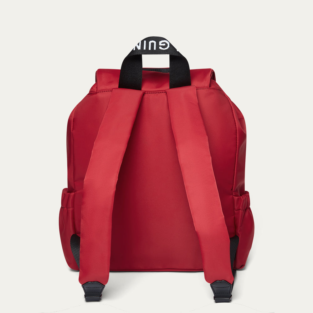 Red backpack with black straps on a white background