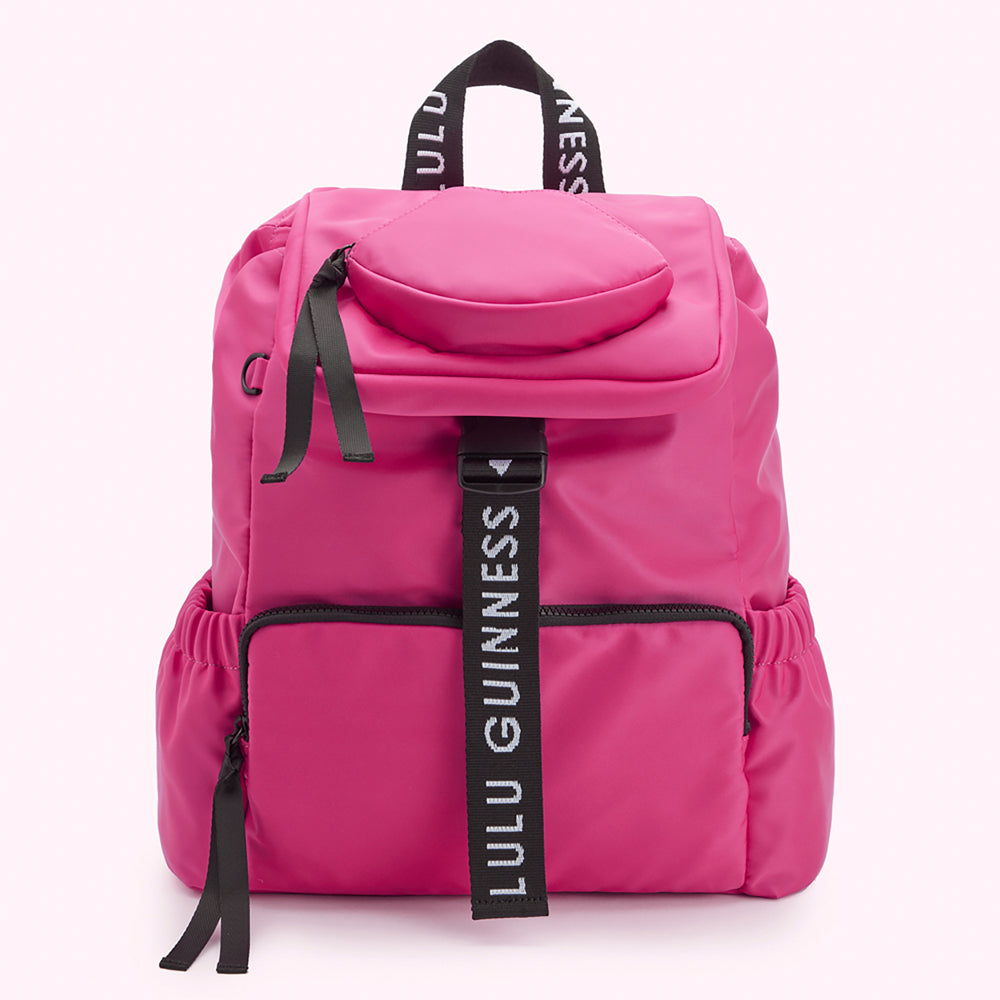 Bright pink Lulu Guinness backpack with black straps and logo.