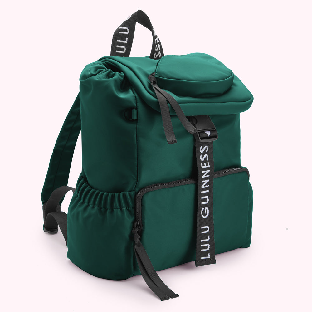 Green Lulu Guinness backpack with black logo straps.