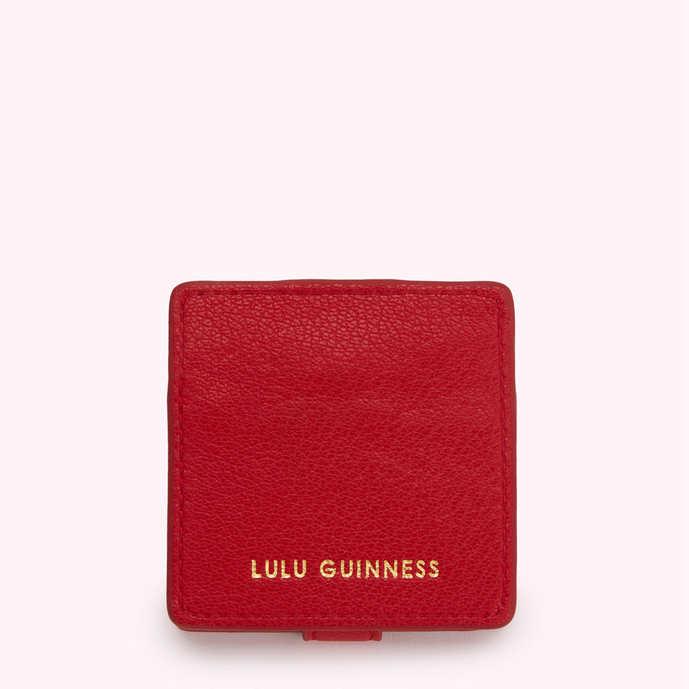 Red Lulu Guinness compact.
