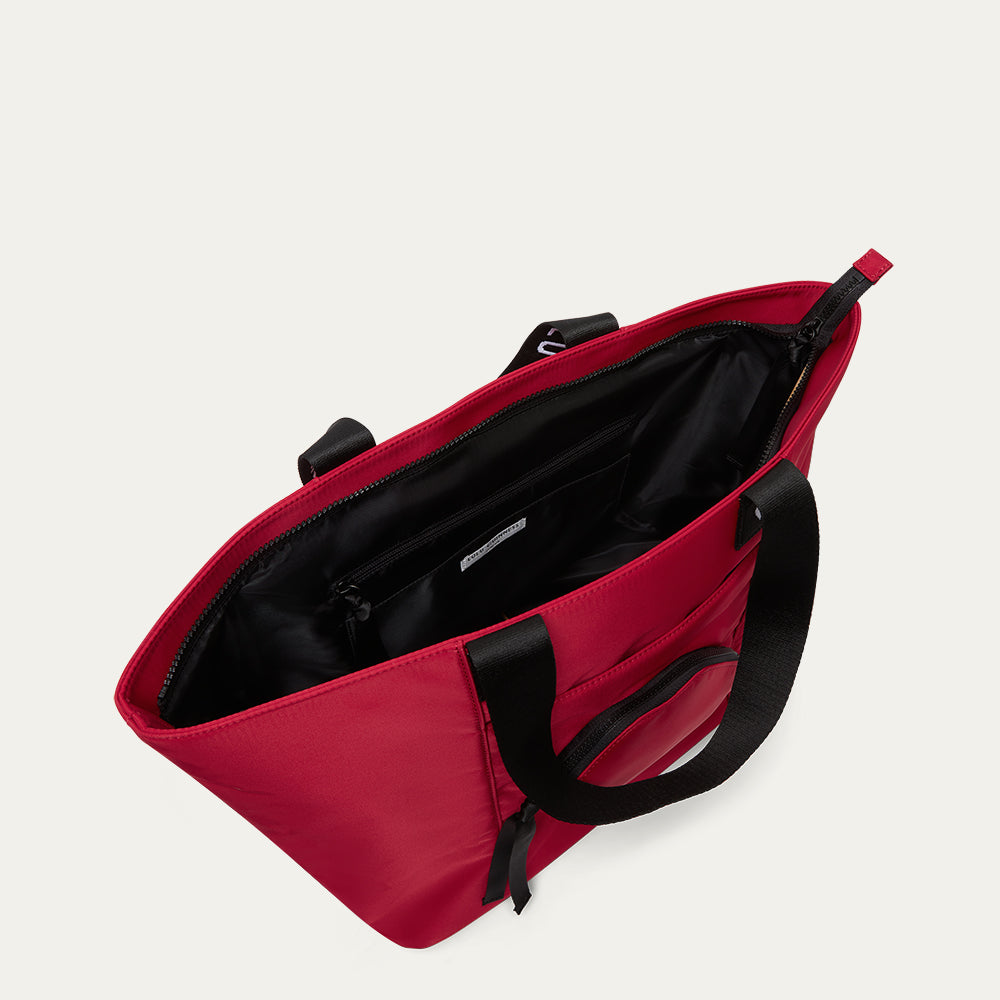 Red bag with black interior on a light grey background