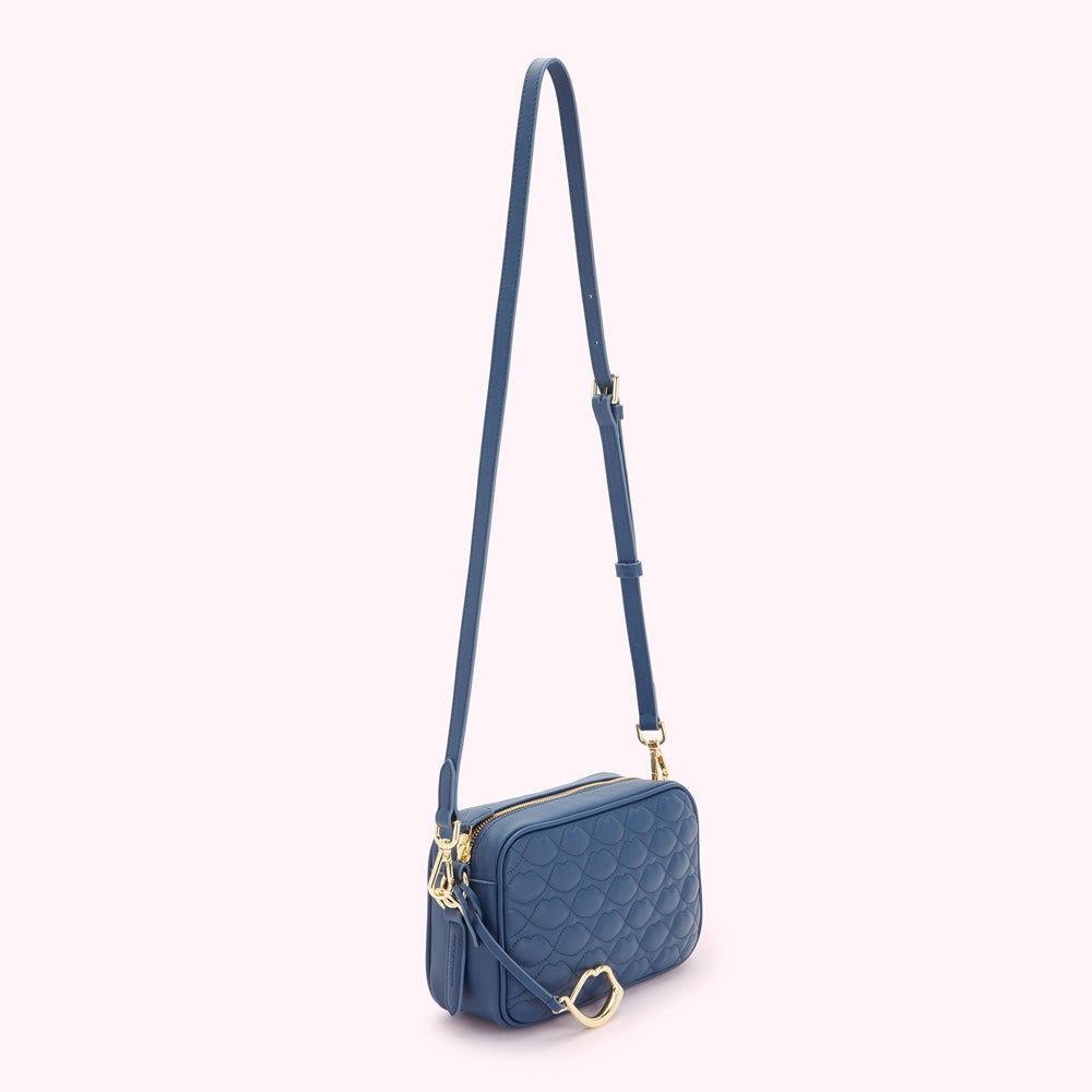 Blue quilted crossbody bag with gold-tone hardware.