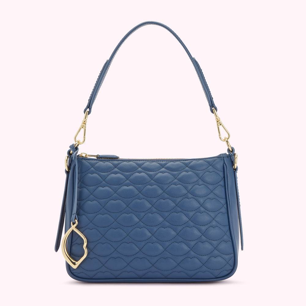 Blue quilted shoulder bag with gold-toned hardware and lip-shaped quilting.