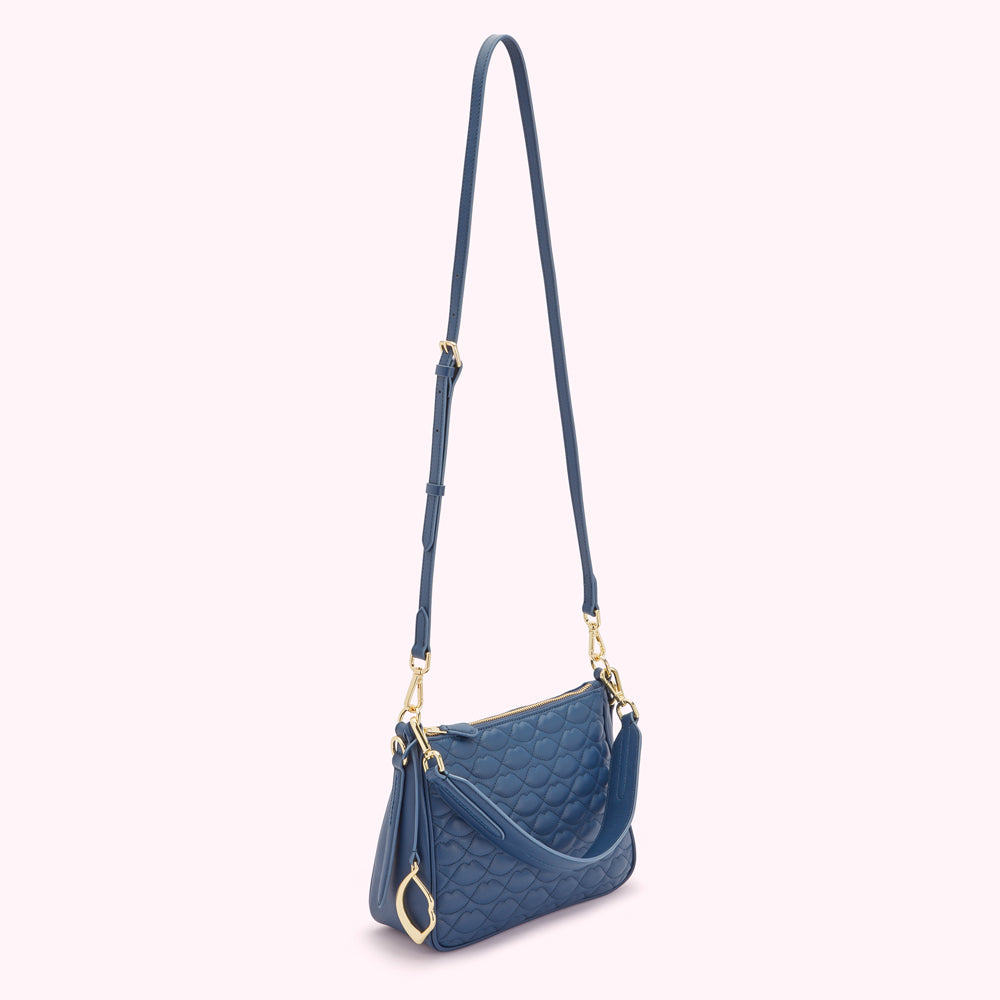 Blue quilted crossbody bag with gold hardware.
