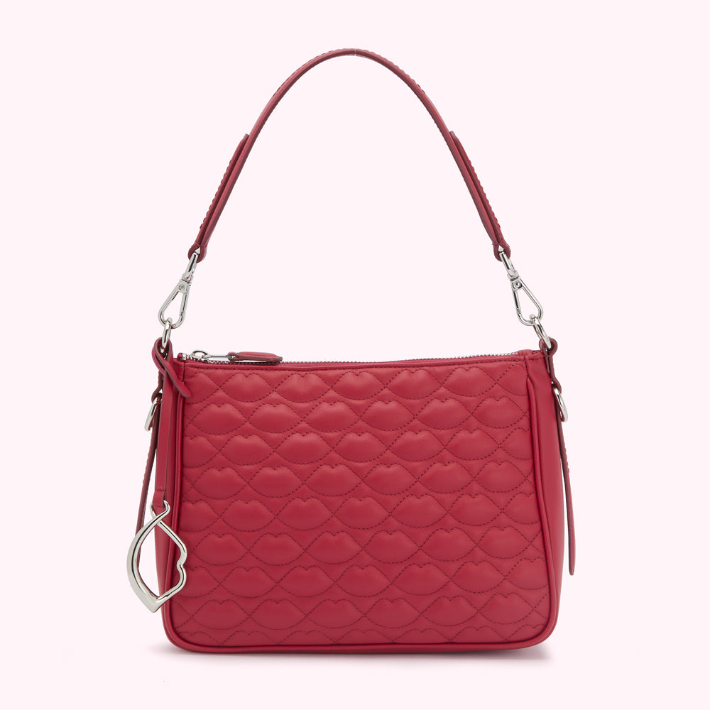 Red quilted leather shoulder bag with lip-shaped pattern.
