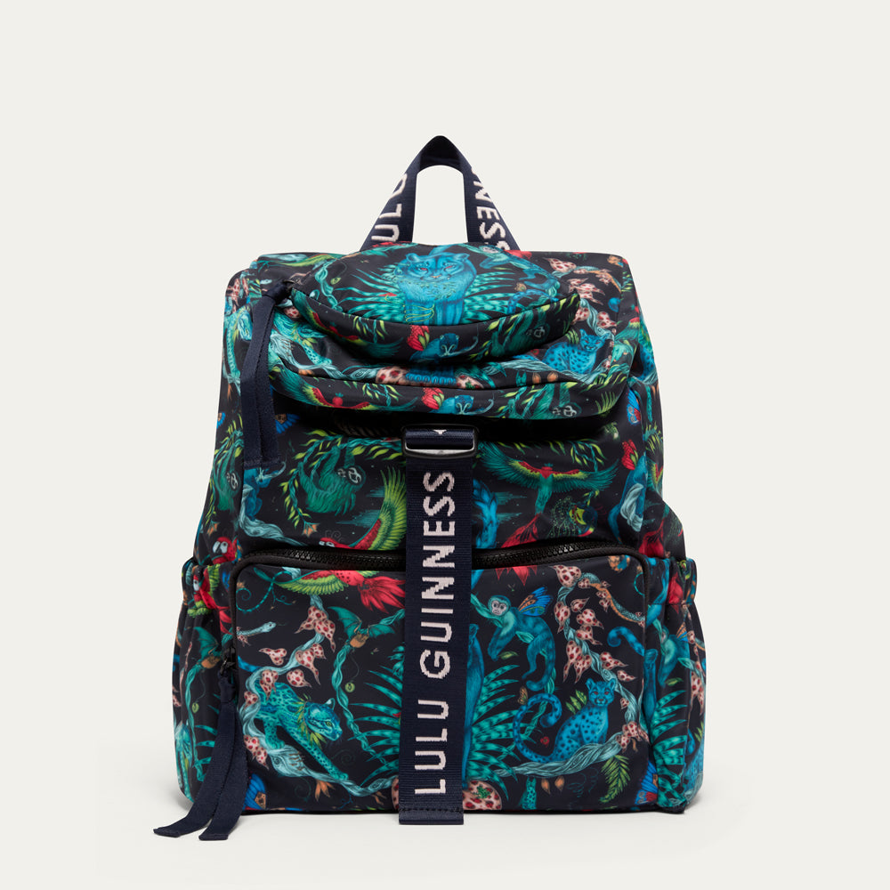 Colorful backpack  by Lulu Guinness x Emma Shipley with floral pattern and 'Lulu Guinness' branding on a white background